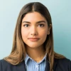 woman in blue lining shirt and black coat